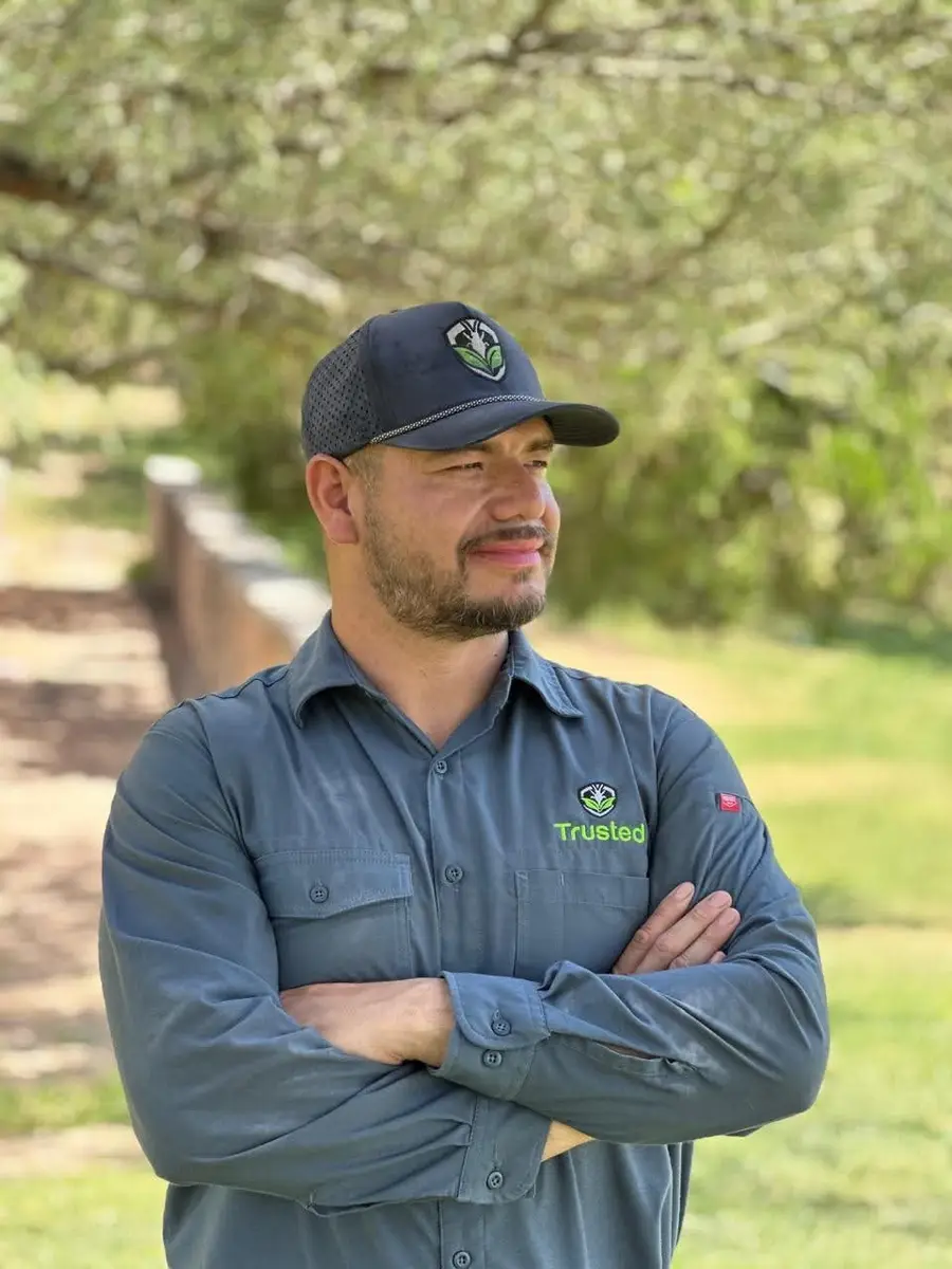 Valentin Moriel outdoors in Seminole, Texas, wearing a Trusted Termite and Pest Solutions shirt